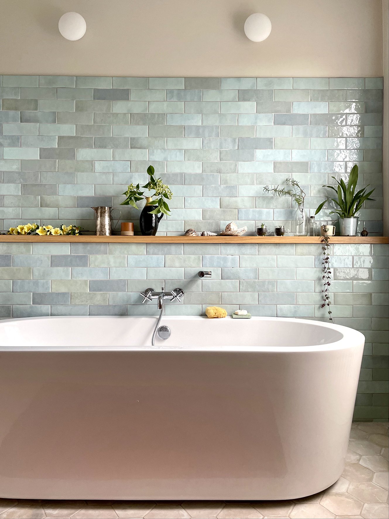 CharlotteBucciero-Interiors-Bathroom-remodel-bathtub-blue-tile-walllight-design.jpg