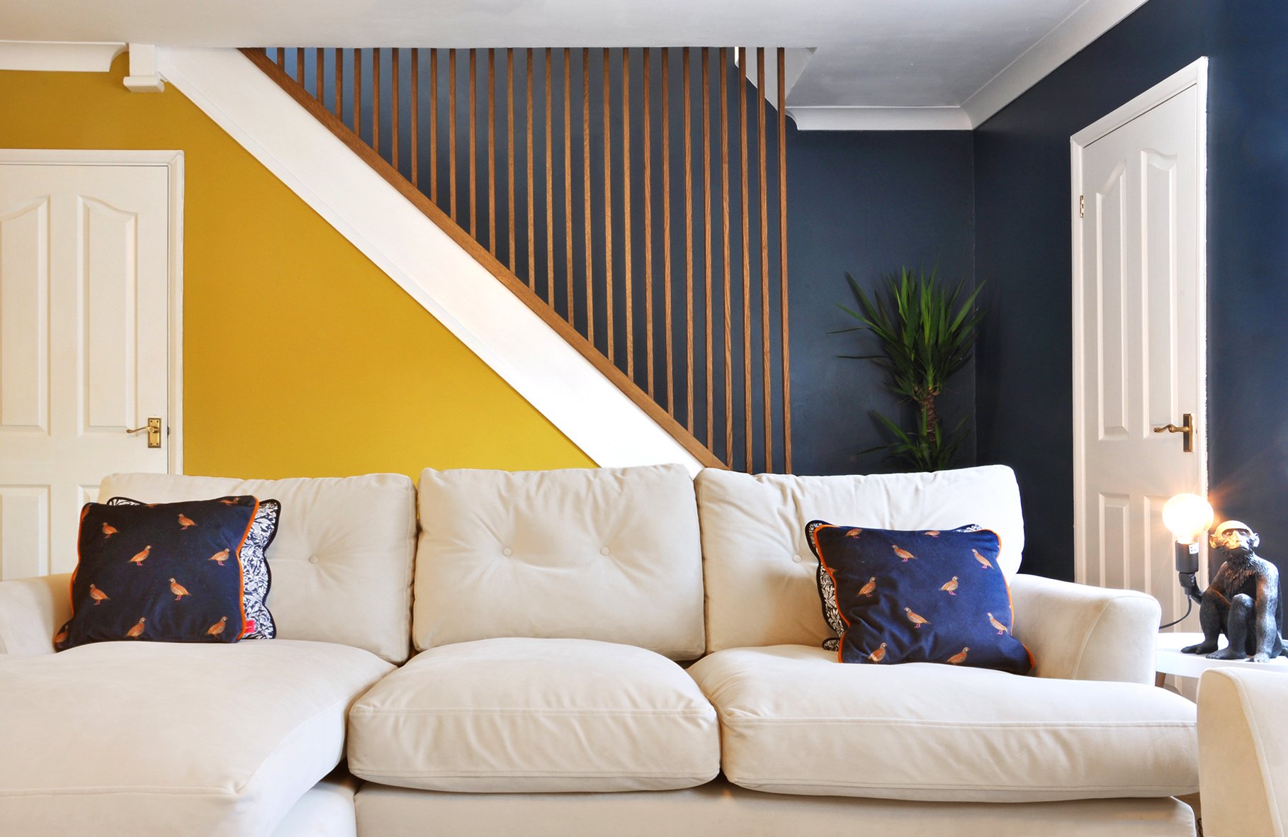CharlotteBucciero-interiors-livingroom-design-cream-sofa-navy-yellow-colourblocking.jpg