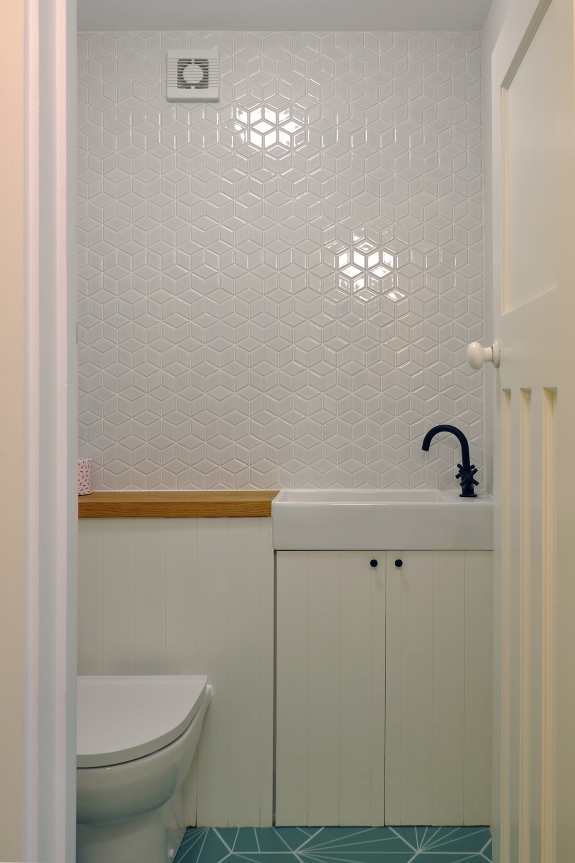 CharlotteBucciero-Interiors-Toilet-design-white-walltile-bespoke-cabinets.jpg
