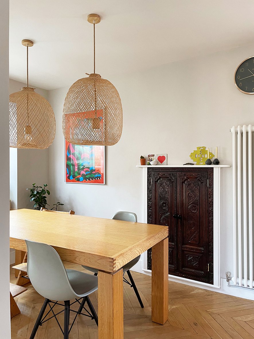CharlotteBucciero-interiors-rattan-pendant-light-oak-dining-room-table-fireplace.jpg