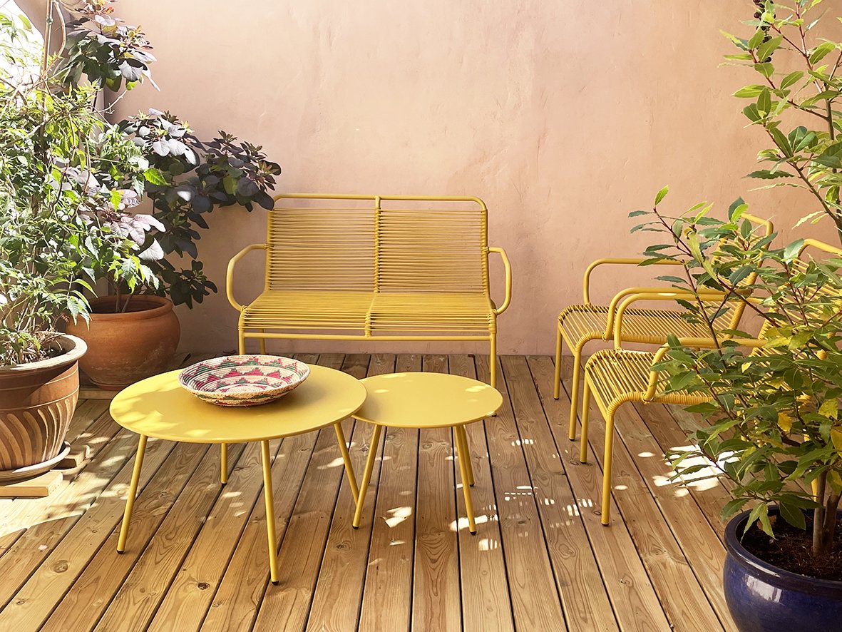 CharlotteBucciero-Interiors-garden-courtyard-outside-oak-decking-yellow-furniture.jpg
