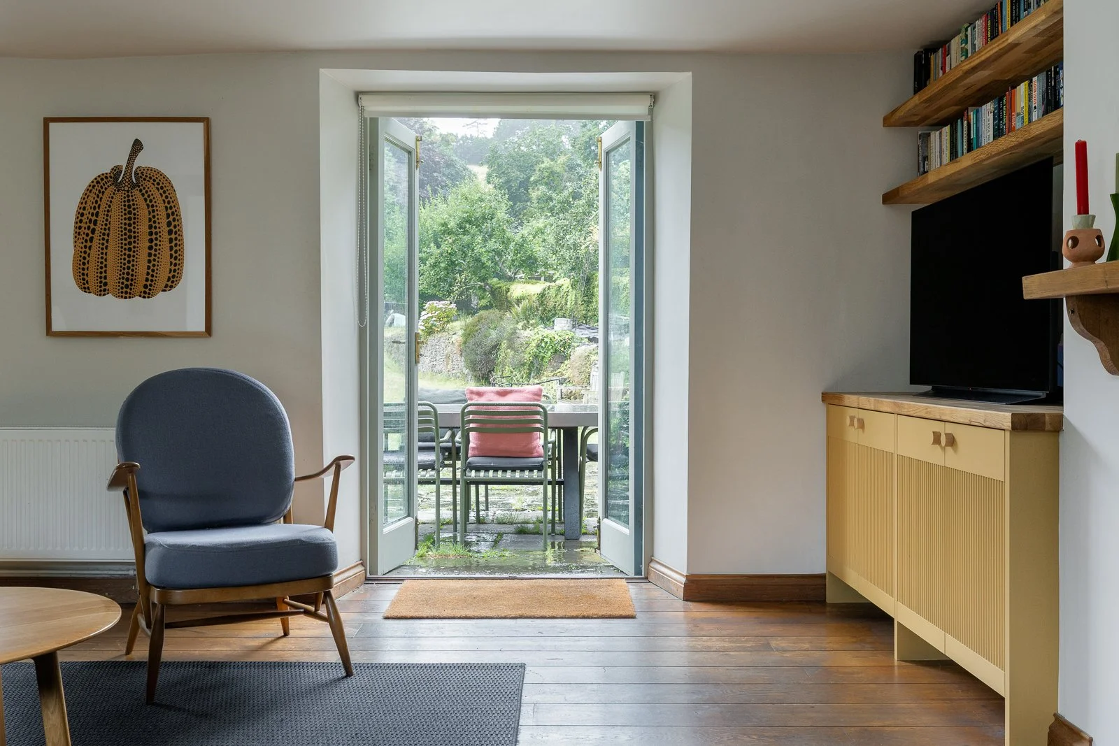 cottage-livingroom-armchair-art-window-charlotte-bucciero-interiors.jpg