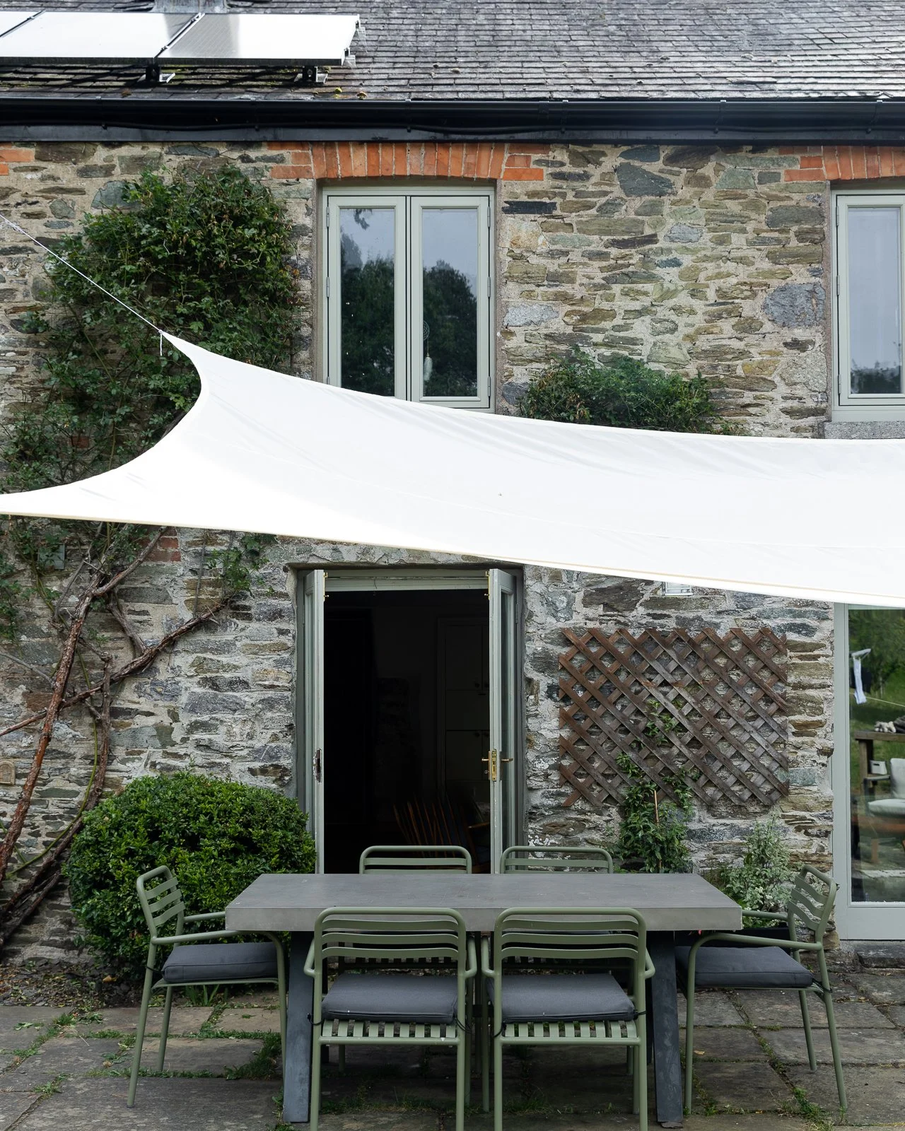 stone-walls-french-doors-outdoor-furniture-charlotte-bucciero-interiors.jpg