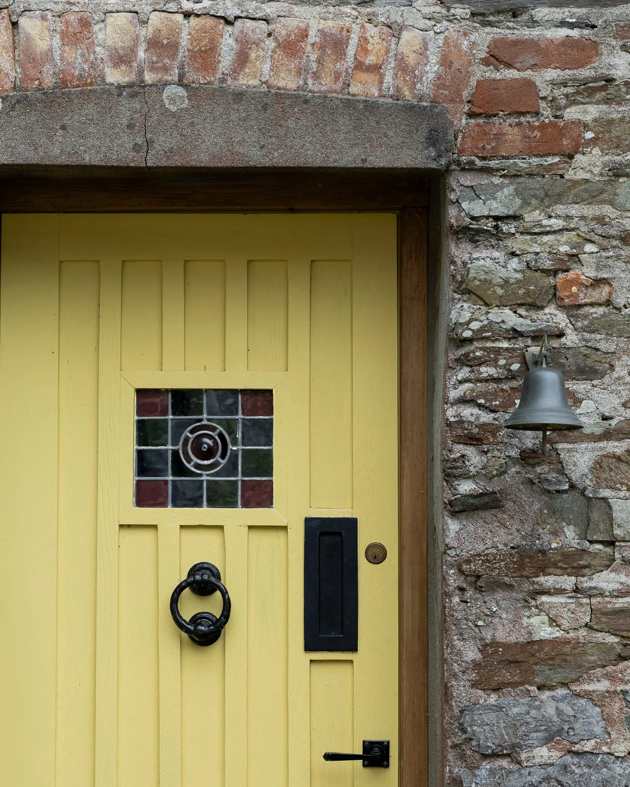yellow-door-stained-glass-bell-charlotte-bucciero-interiors.jpg