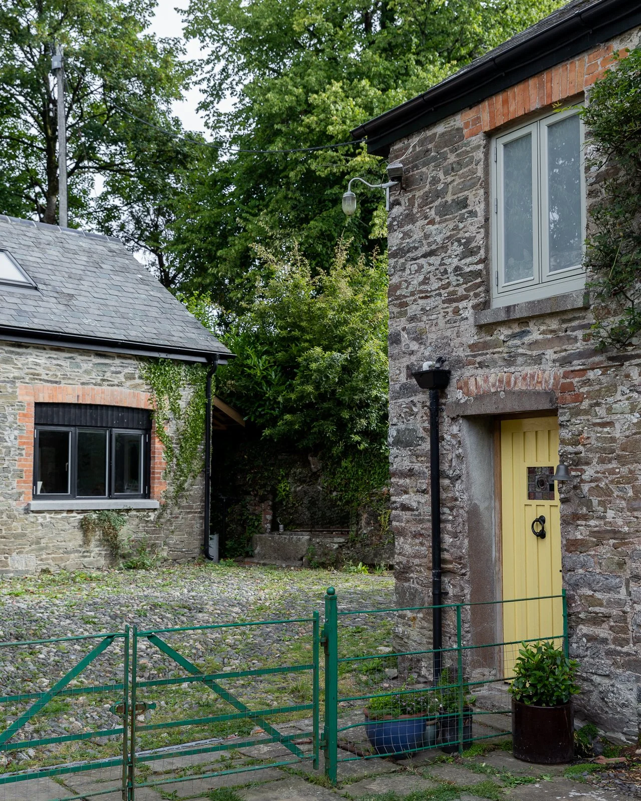 cottage-courtyard-stone-walls-charlotte-bucciero-interiors.jpg