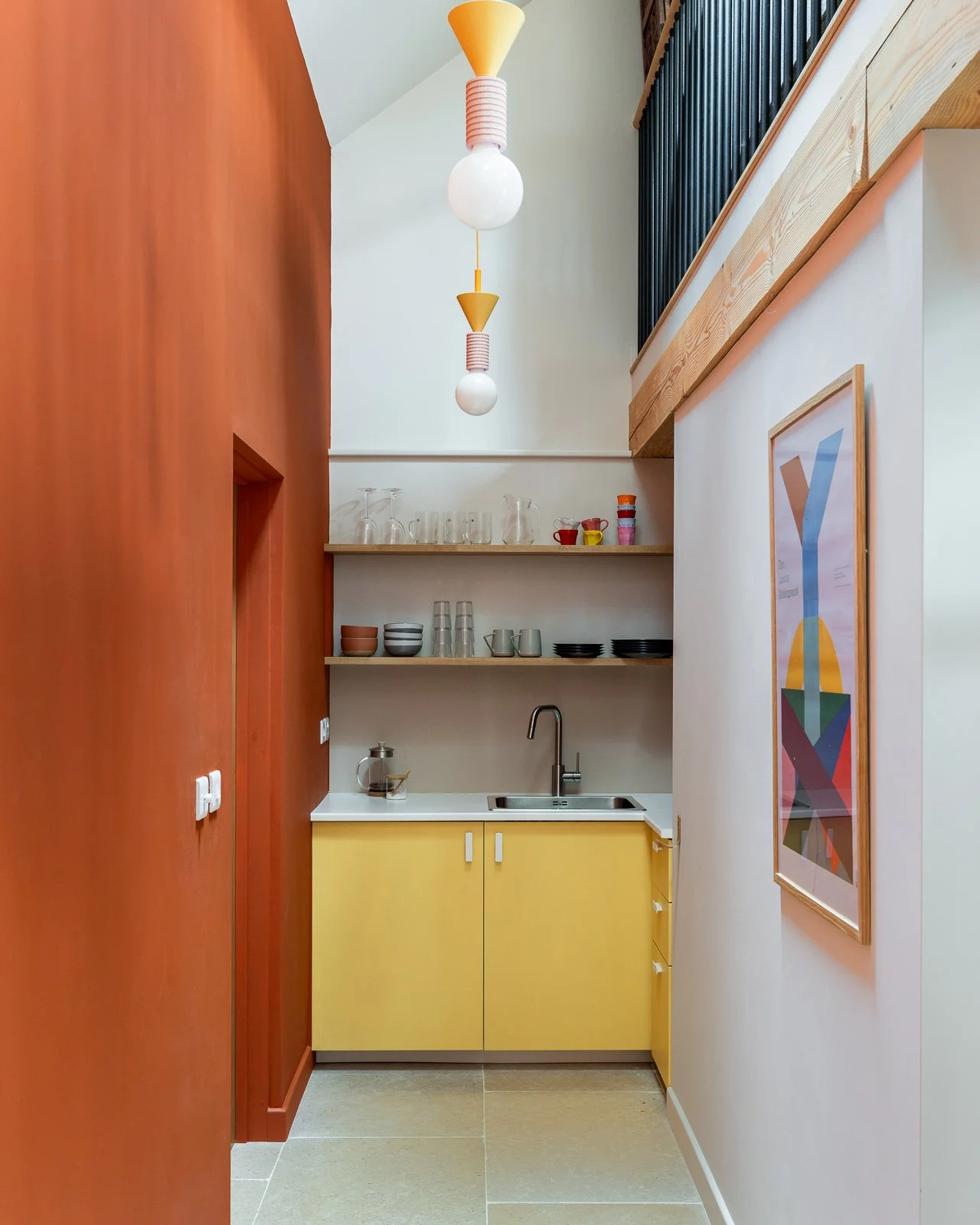 mezzanine-kitchen-yellow-lighting-orange-charlotte-bucciero-interiors.jpg