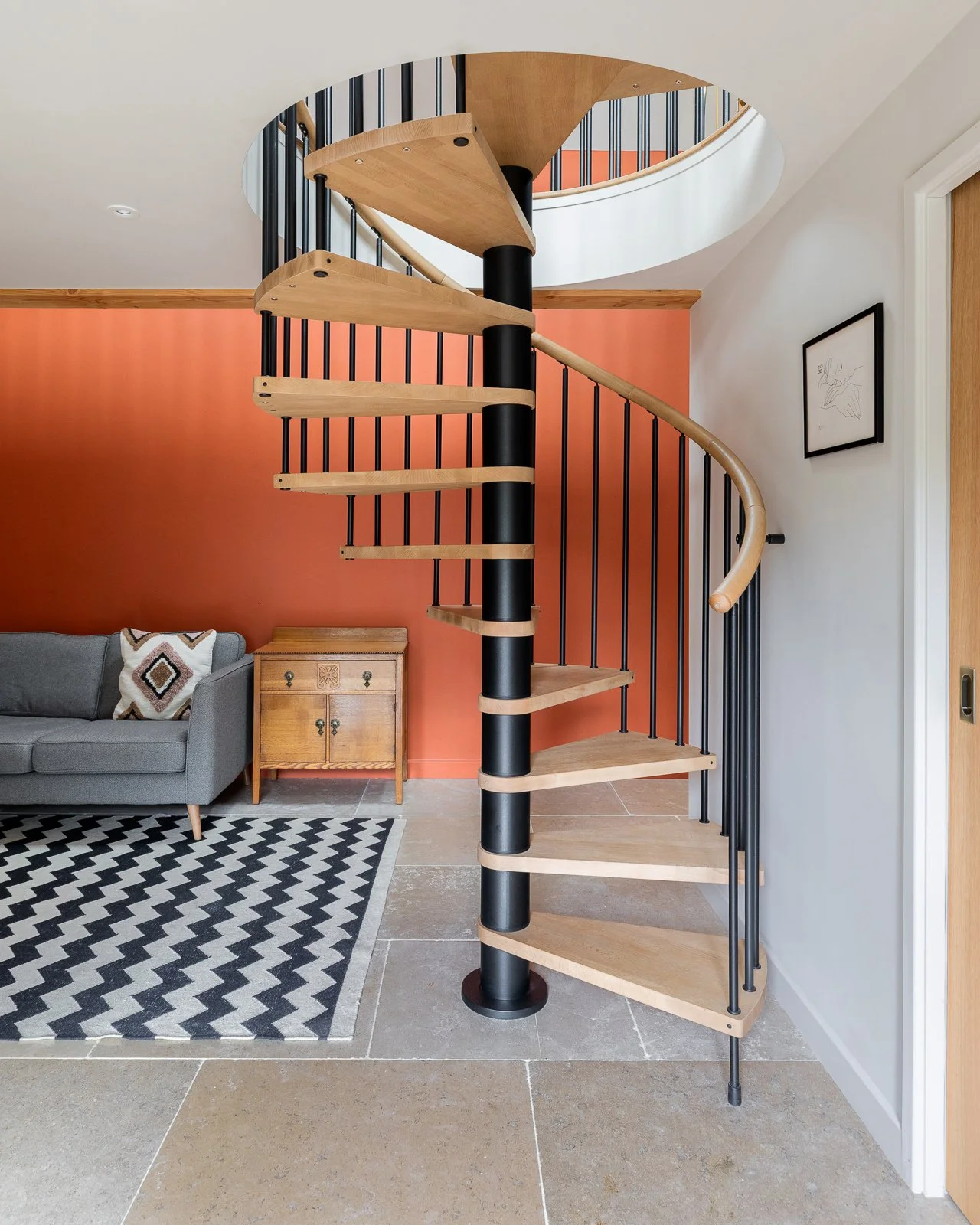 spiral-staircase-orange-wall-mezzanine-charlotte-bucciero-interiors.jpg