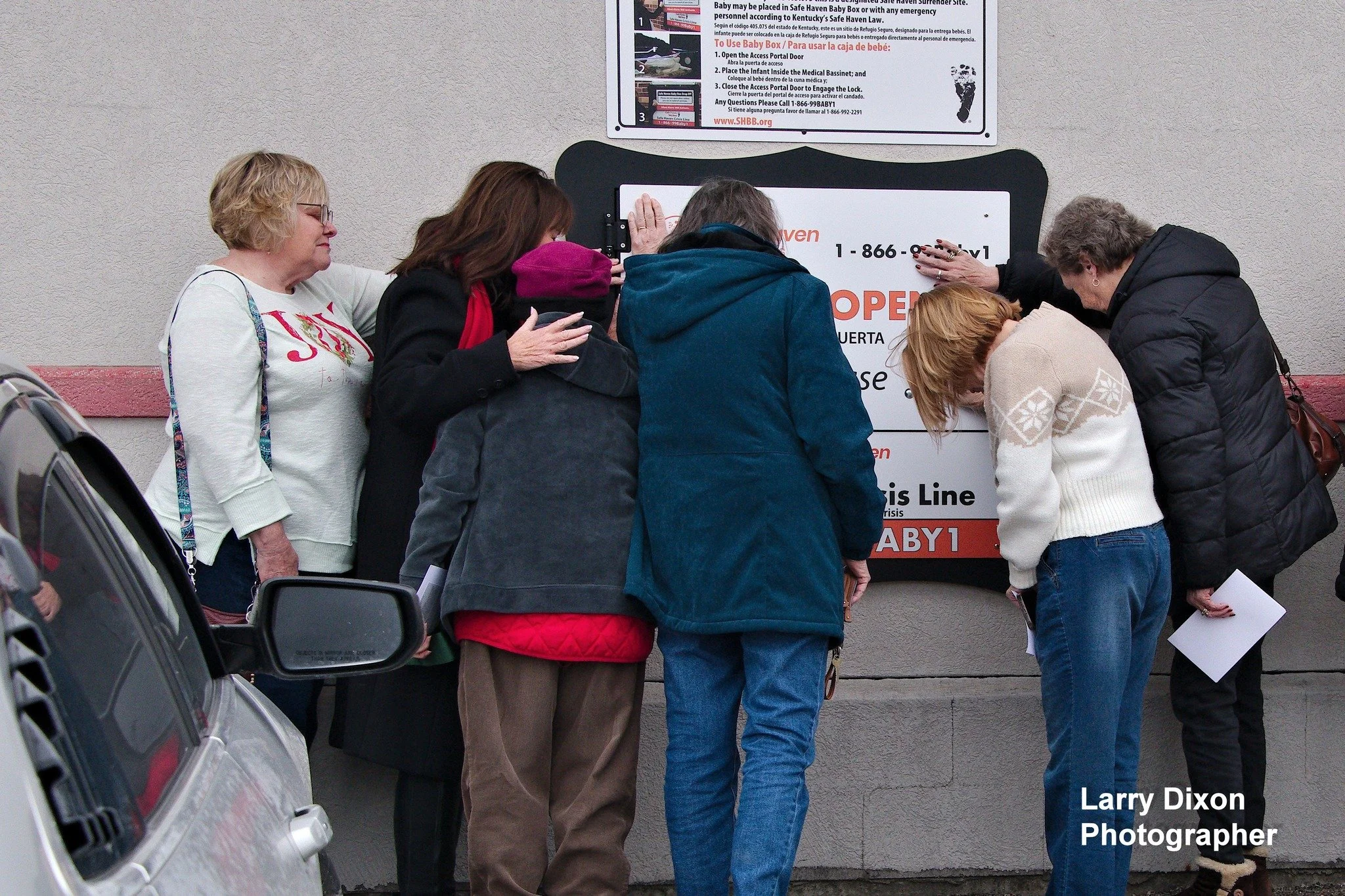 Praying over box.jpg