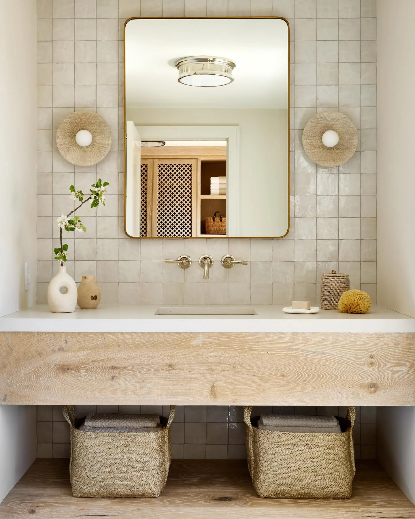 With summer on the horizon, this breezy powder room off the pool offers effortless access from beach to bath. 

Photo @readmckendree