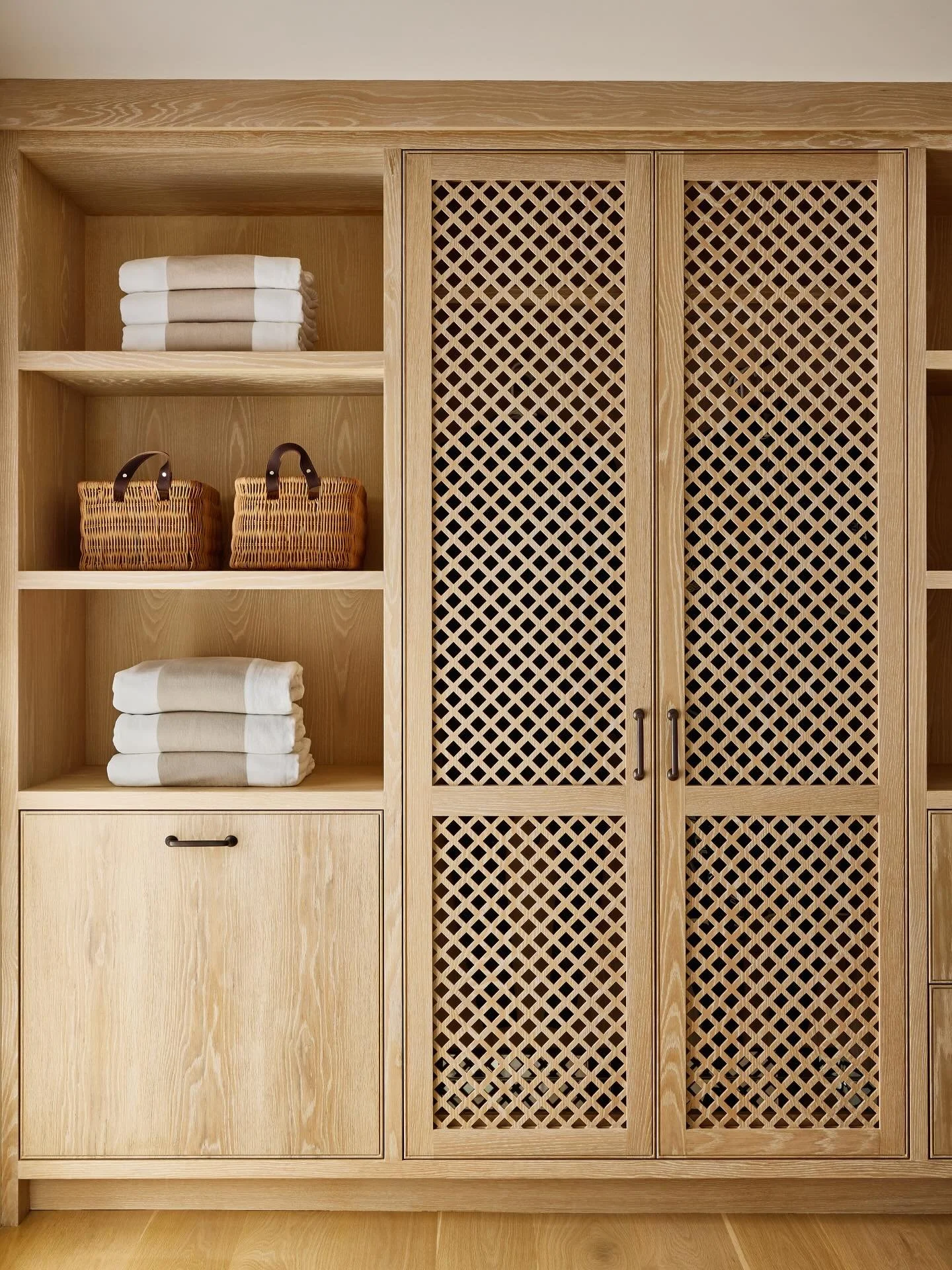 Beach Room storage // swipe to see this thoughtfully designed millwork cabinet with perforated doors for ventilation 

Photo @readmckendree