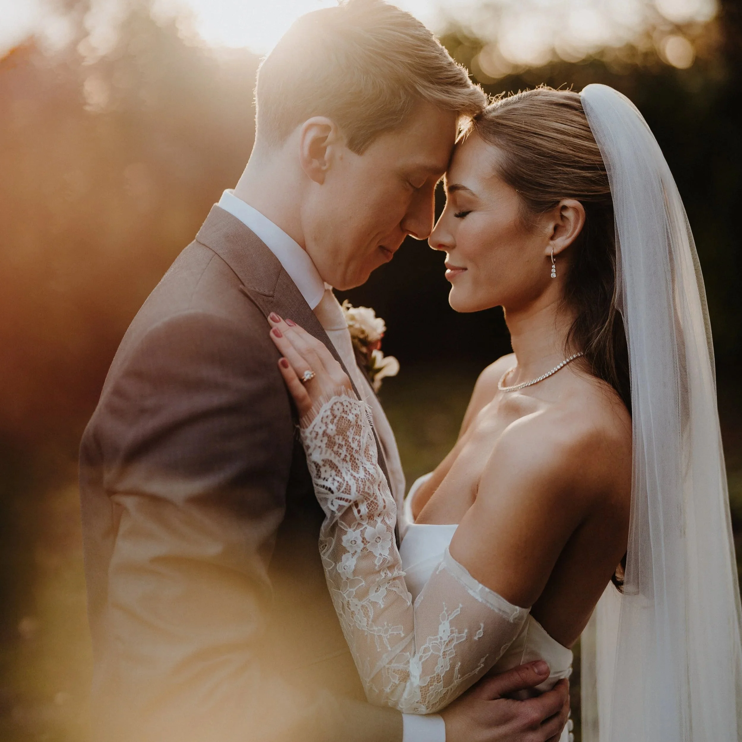 A Modern Minimalist Wedding Dress with Lace Sleeves for a Winter Wedding