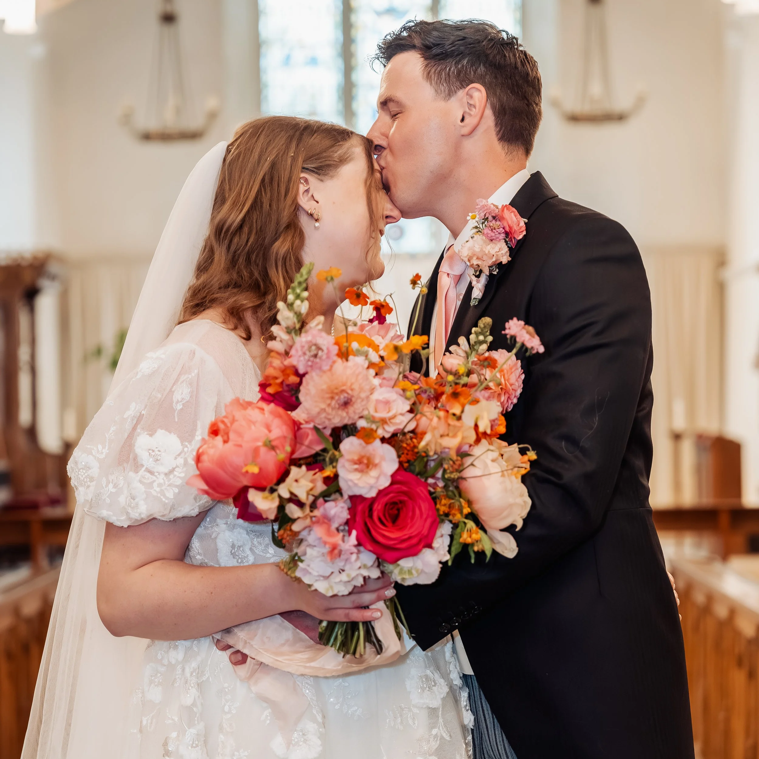 A Floral Wedding Dress for a Romantic Vineyard Wedding at Old Luxters Barn