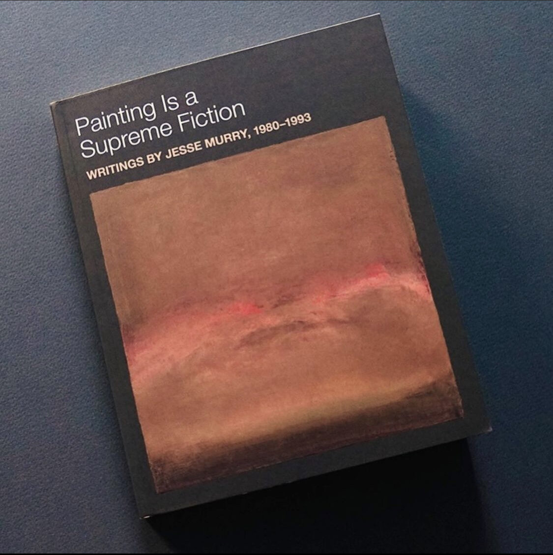 Image: The cover of one of Soberscove's upcoming titles: Painting is a Supreme Fiction, Writings by Jesse Murry, 1980–1993, edited by Jarrett Earnest with foreword by Hilton Als, which has an abstract, colorfield painting in subdued warm, neutral tones at its center.