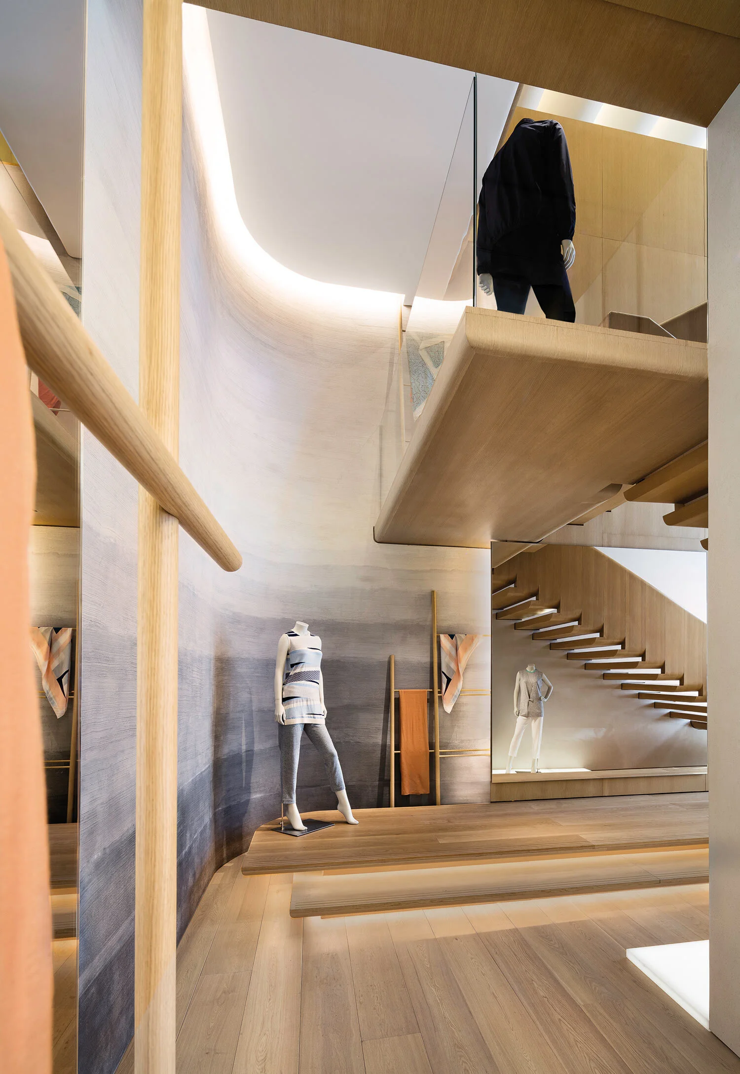 An interior of 1436 Flagship Store displaying a display room and a staircase