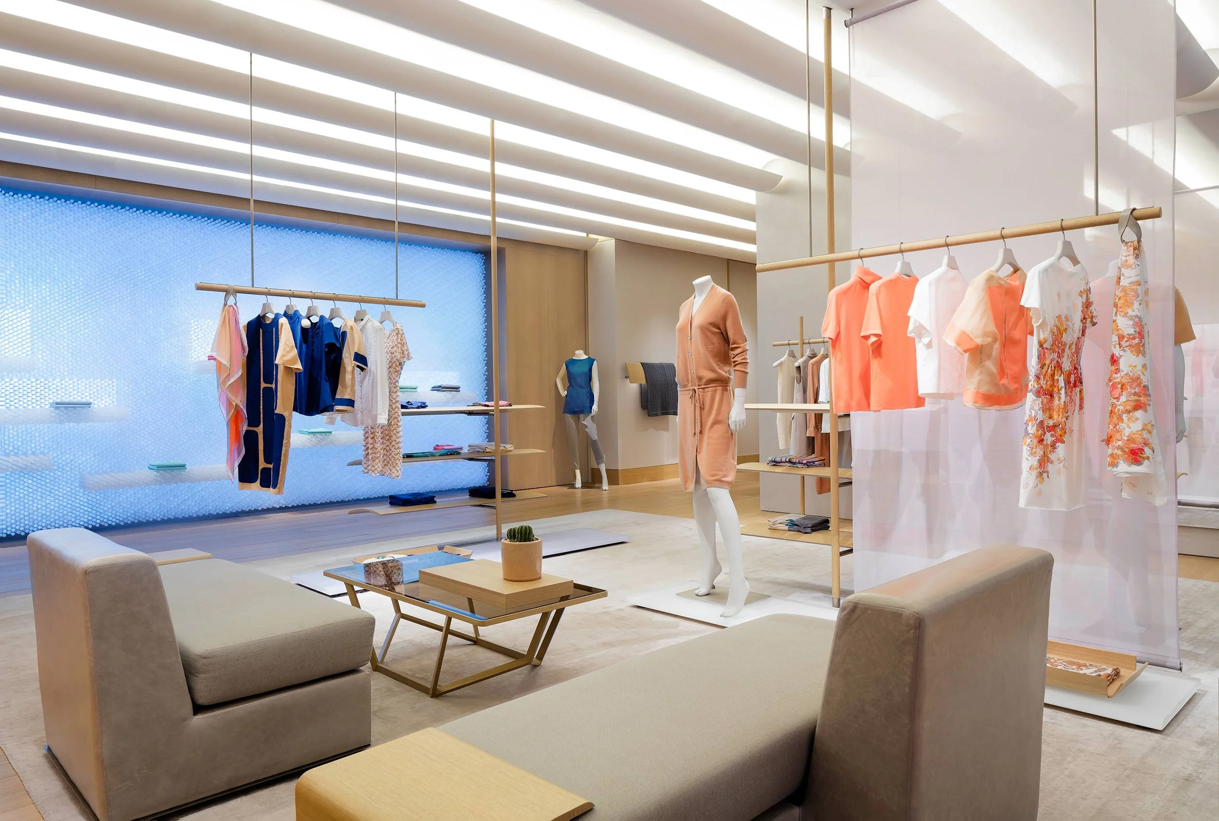 An interior view of seating furniture and clothing inside the 1436 Flagship Store