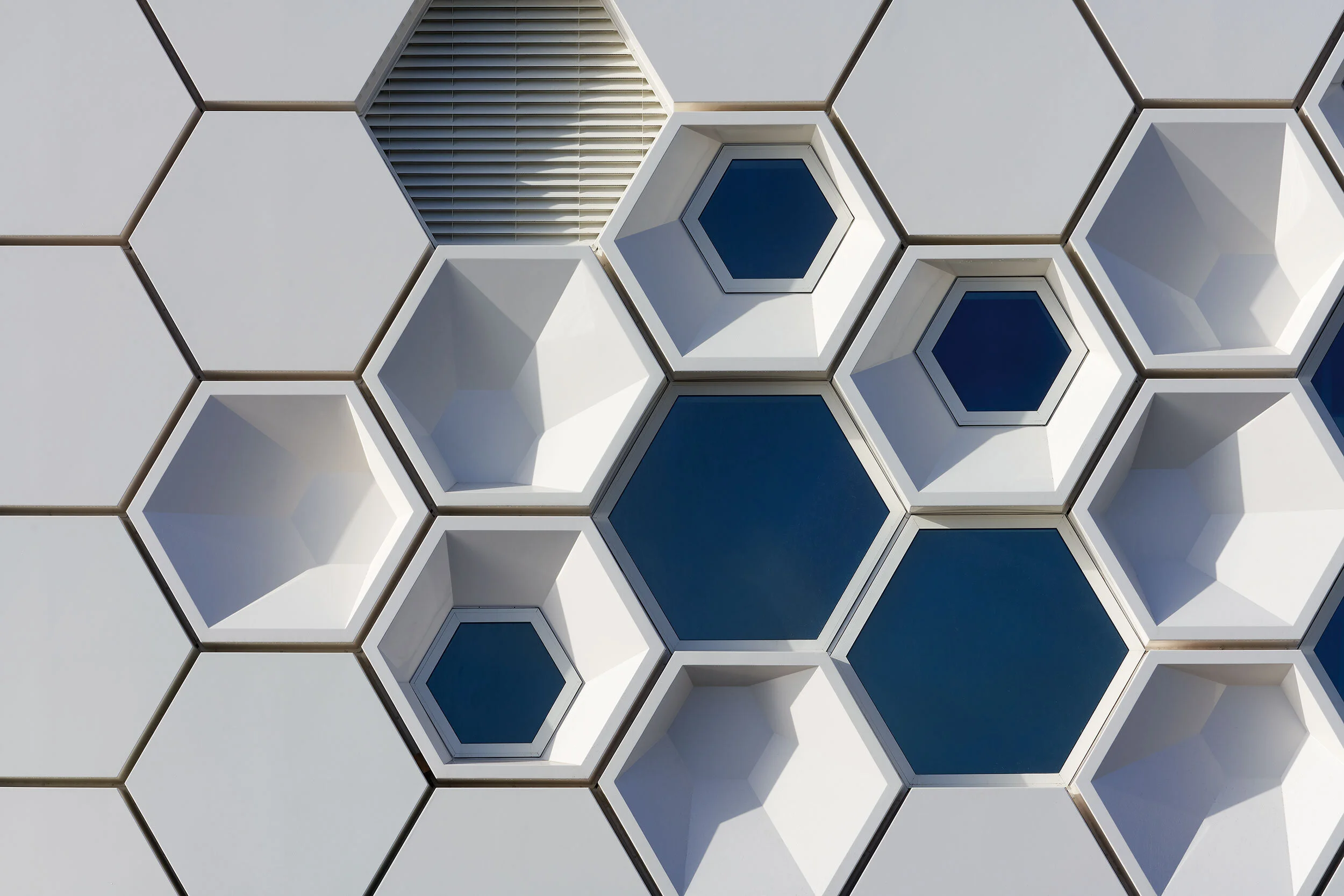 A honey comb exterior of a wall of the Afsluitdijk Wadden Center Kornwerderzand