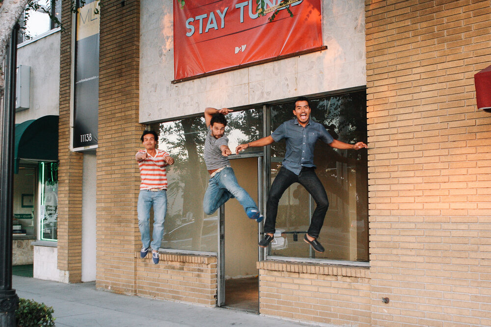  The day we hung the "Stay Tuned" banner from the roof. This photo became the cover for the newspaper story announcing the opening of an art gallery in Downey.&nbsp; Photo by Laura Hurtado.  