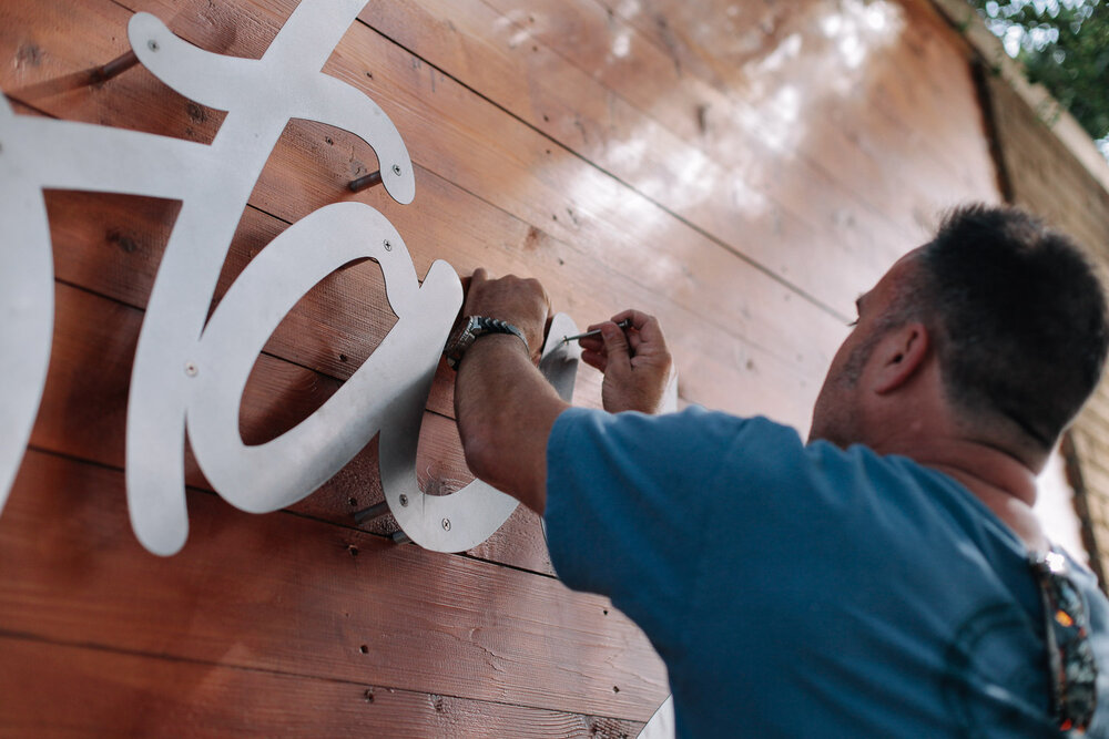  Don Lamkin putting the final touch on the sign. This was a BIG deal for us. 