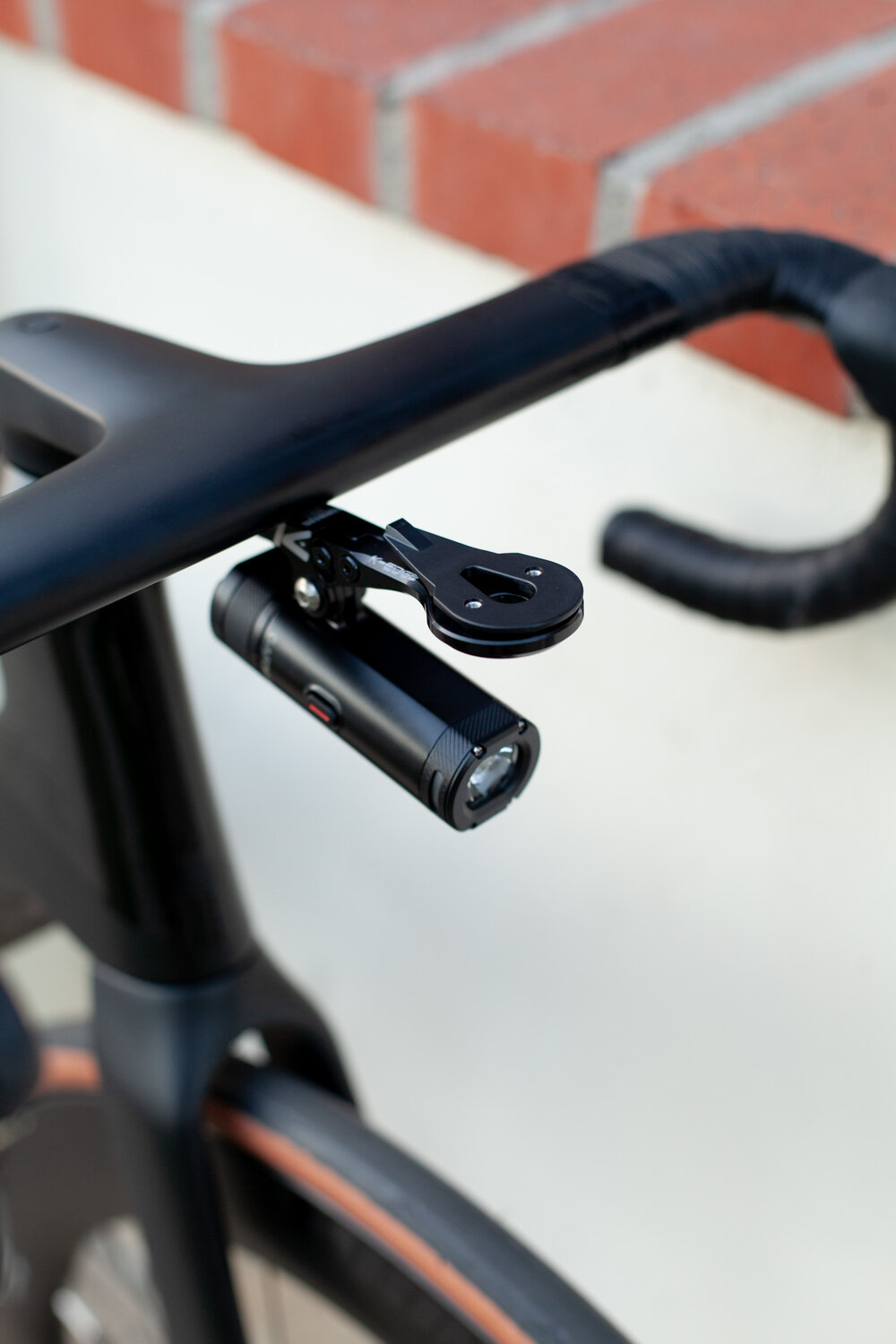  K-Edge Integrated Handlebar System Mount with Hammerhead Karoo 2 proprietary mounting piece and Garmin Varia UT800 light 