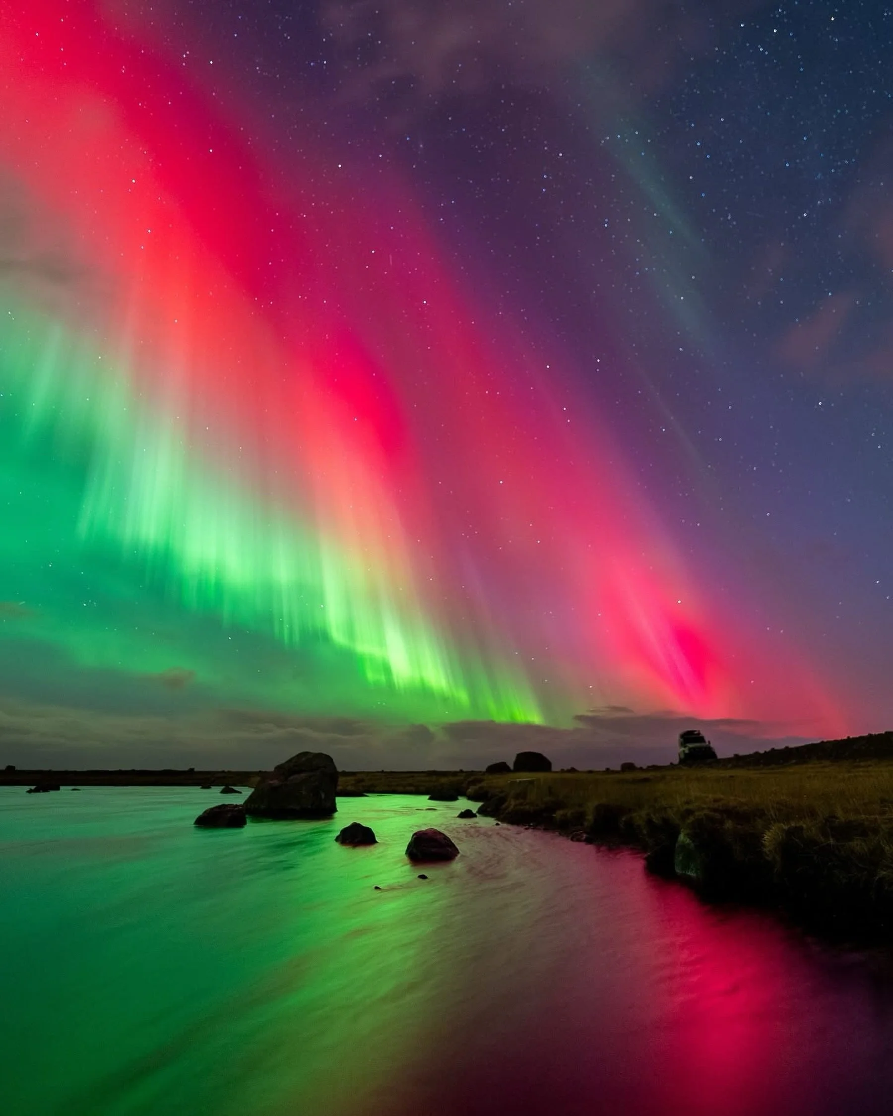 Catching the red Northern Lights reflecting across a perfectly still lake.

Seeing a red aurora is already something special, but watching the colors mirrored across the water made the whole scene feel unreal.

Sometimes Iceland gives you a night whe