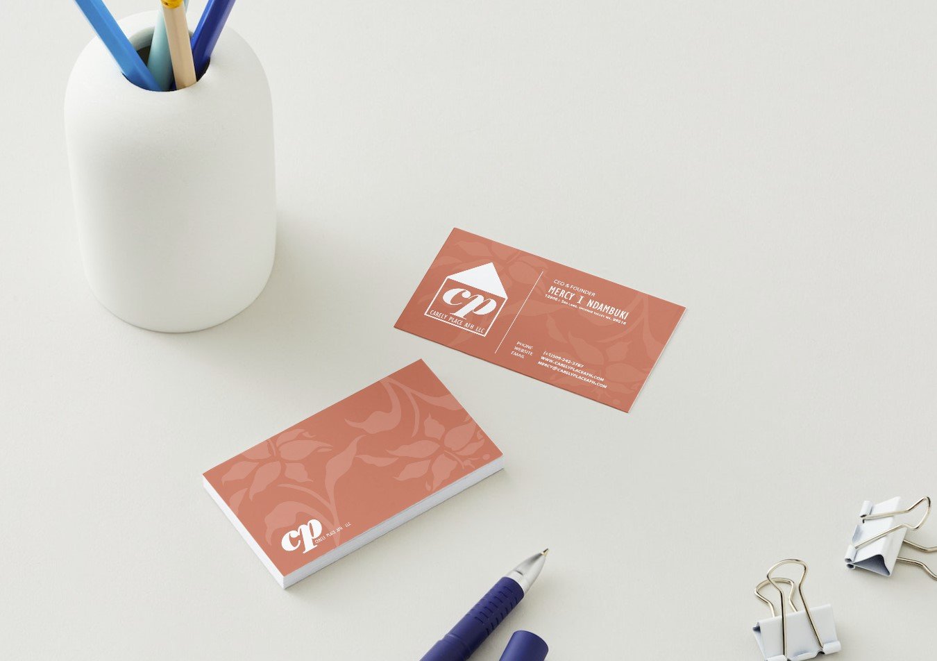 21051401 - Carely Place AFH - Business Cards  - Front & Back - Desk.jpg