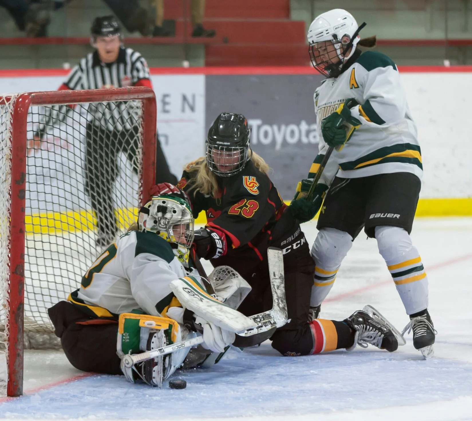  Regina Cougars’ goalie, Morgan Baker, stretches out to make a save against the Calgary Dinos during Alberta Colleges Athletic Conference regular-season play at the Father David Bauer Olympic Arena in Calgary on Friday, Oct. 4, 2019. Baker went on to