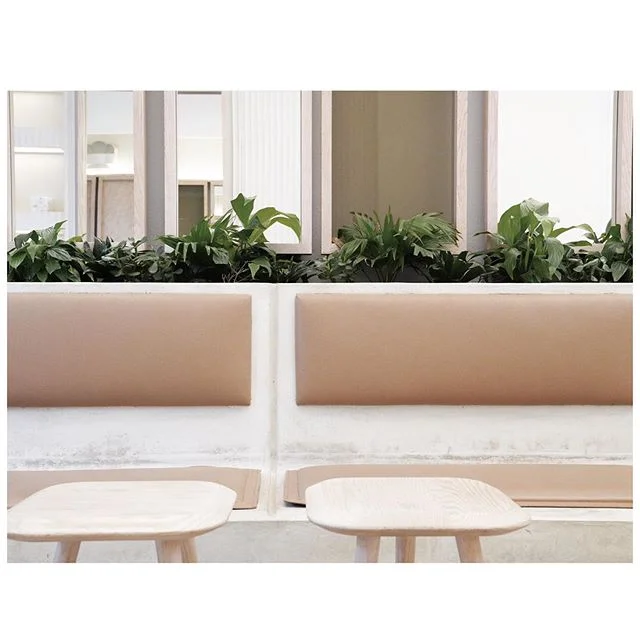 bringing the outdoors inside in the midst of a robust city life.
.
the bench is made out of casted concrete embedded with custom-made leather cushions.
.
the oak wood tables + stools are irregular in shape to give the natural organic feel to the spac
