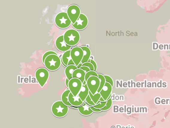 Map of the United Kingdom and surrounding countries with numerous green markers, some with stars and some with location pins.