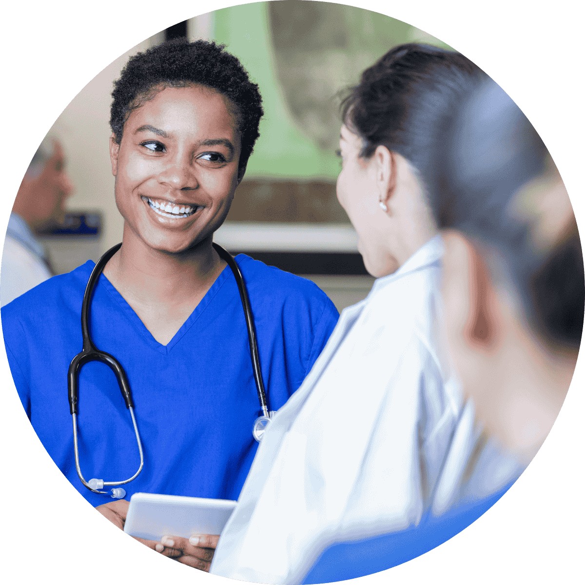 a female registered nurse smiling at a patient