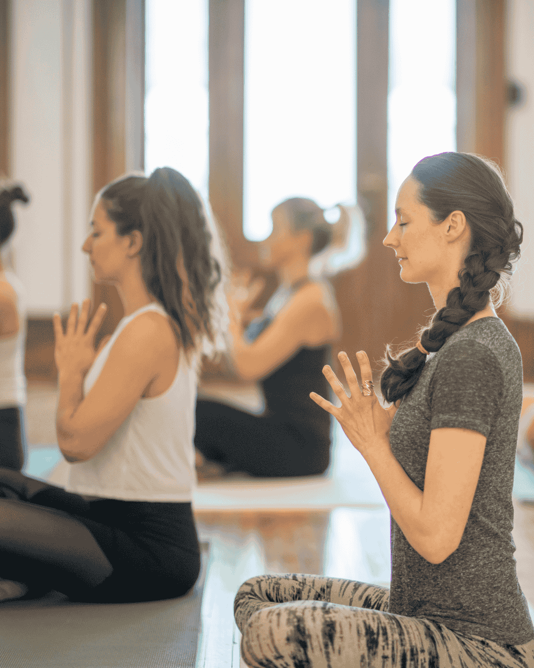 Corporate employees in a meditation class