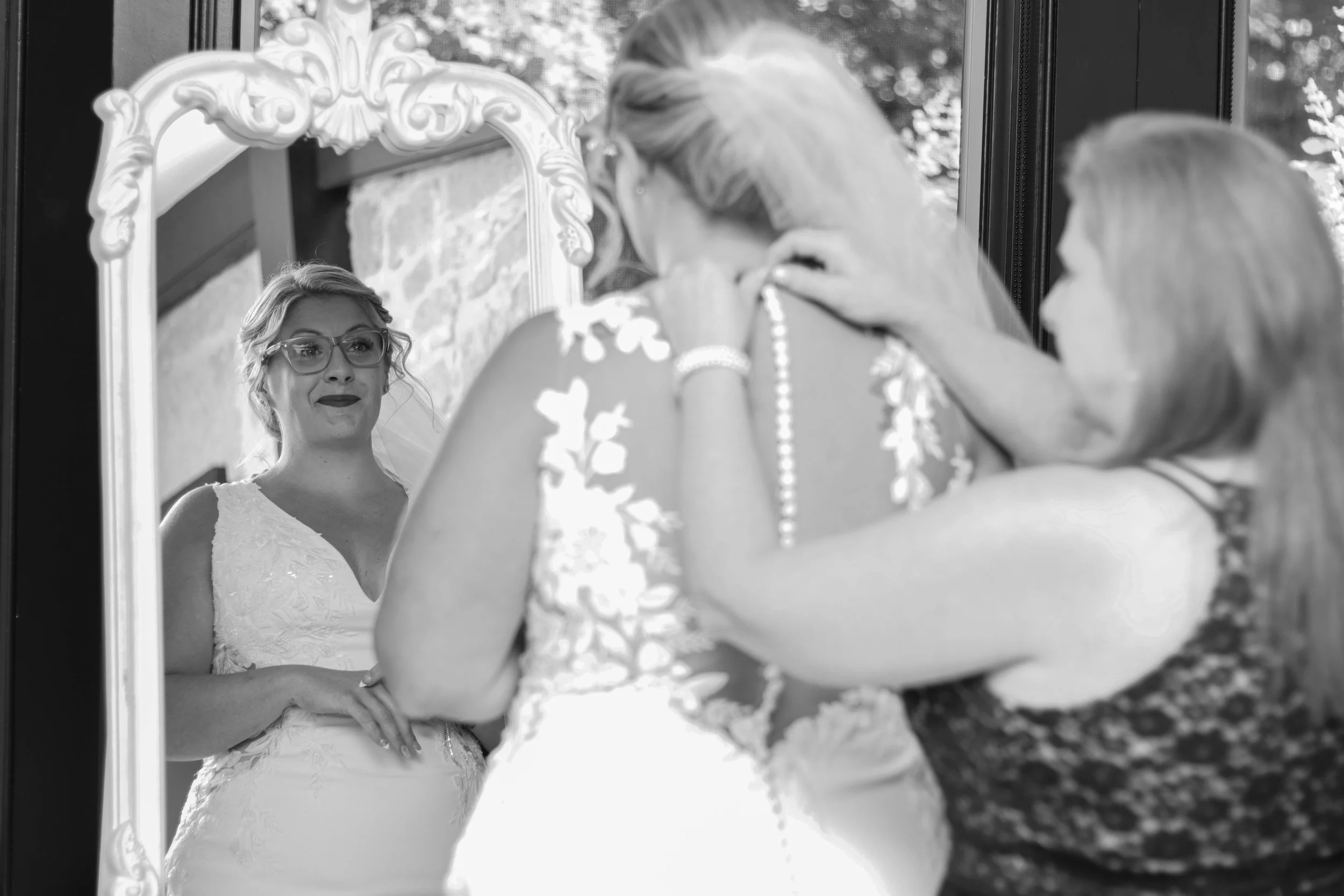 Candid Mother and Daughter moment before wedding ceremony.