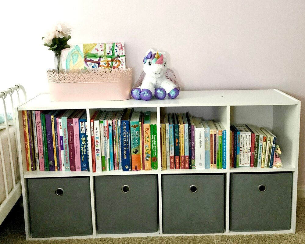 children's books on the top shelf and organize them by descending order