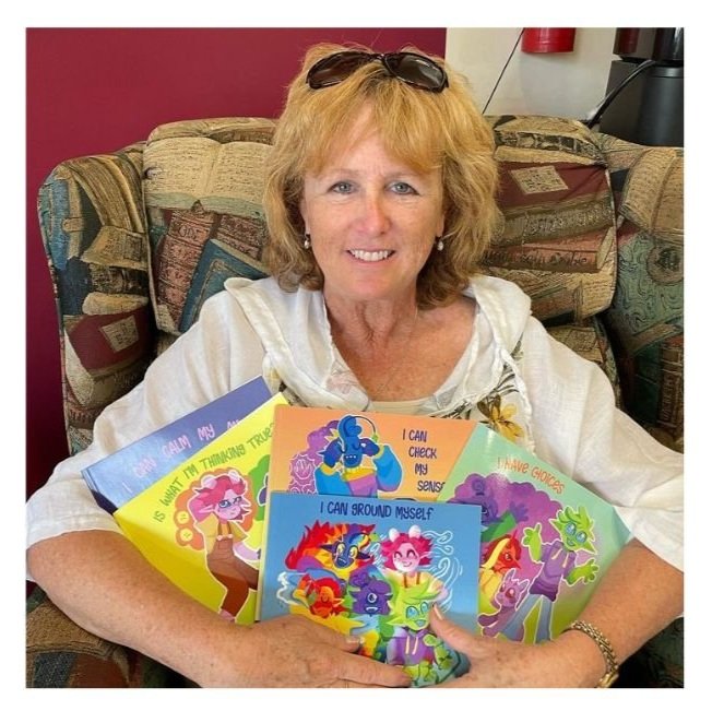 Lynn McLaughlin holds the five books in The Power of Thought series at a local bookstore in Windsor Ontario