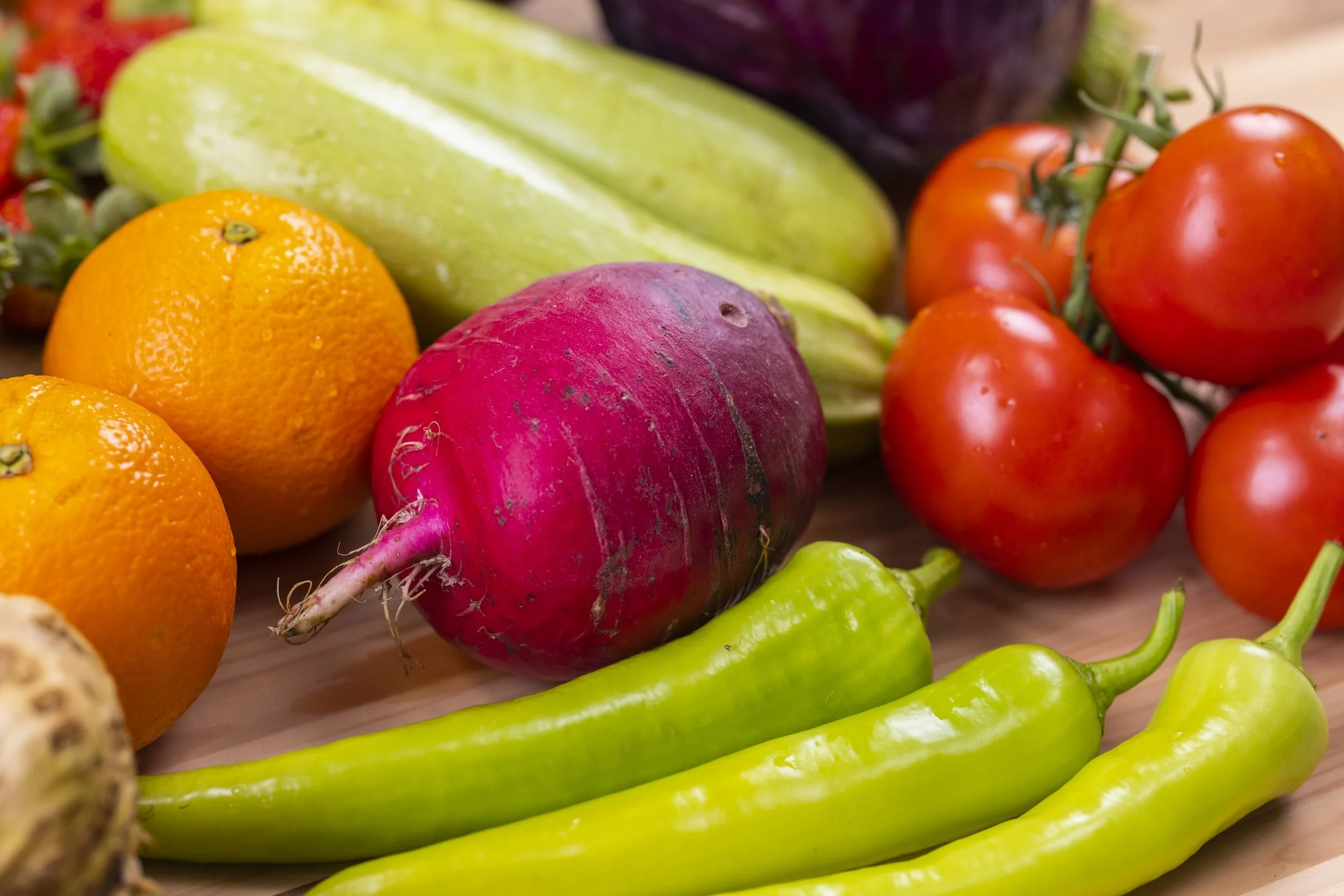 Eating a rainbow of fruits and veggies is a good approach to increasing your nutrient intake.  Image of colorful produce.