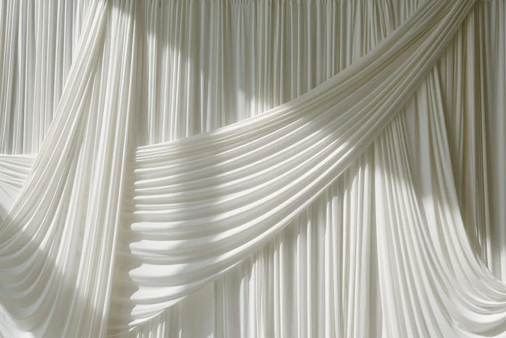 Drapery is not just decor, it's atmosphere.

It frames your ceremony, softens your reception, and elevates every photo with timeless texture and flow.

This is where design becomes feeling .And your wedding day? Effortless, intentional, unforgettable