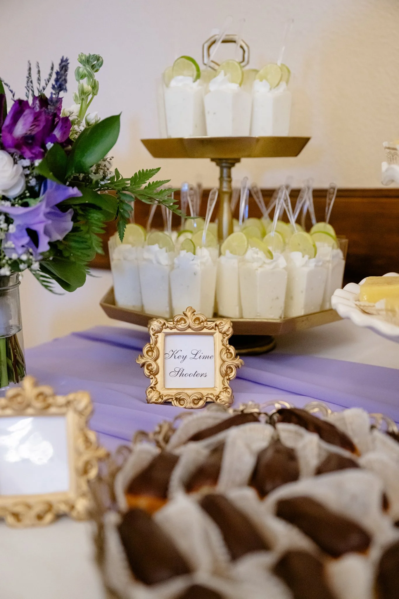   Portland Oregon wedding dessert table featuring key lime dessert shooters topped with fresh lime slices, styled for an elegant reception.  