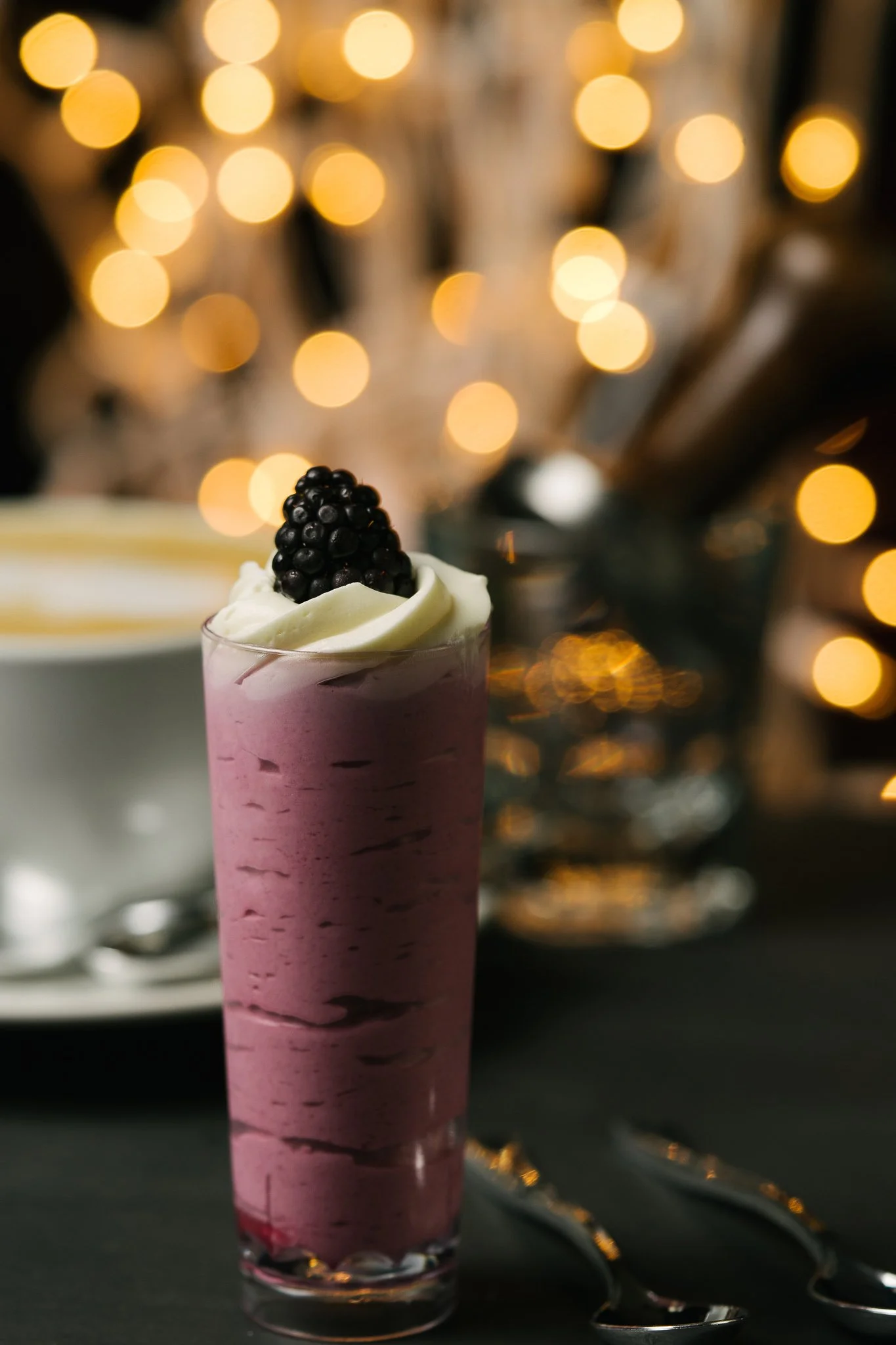   Elegant Portland Oregon wedding dessert shooter featuring a berry mousse topped with whipped cream and fresh blackberry.  