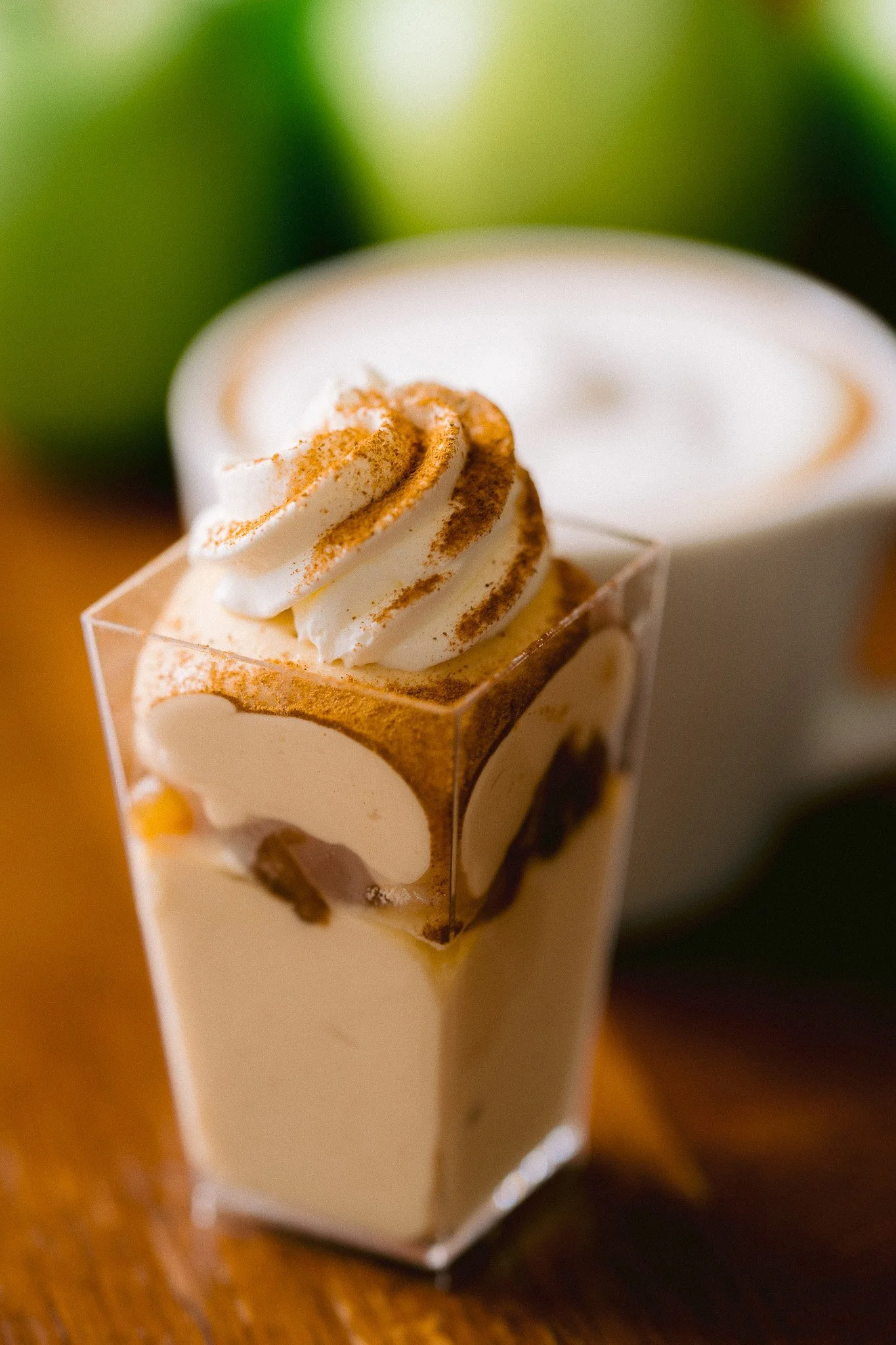   Portland Oregon wedding dessert shooter featuring a creamy layered mini dessert topped with whipped cream and cinnamon, styled for an elegant reception.  