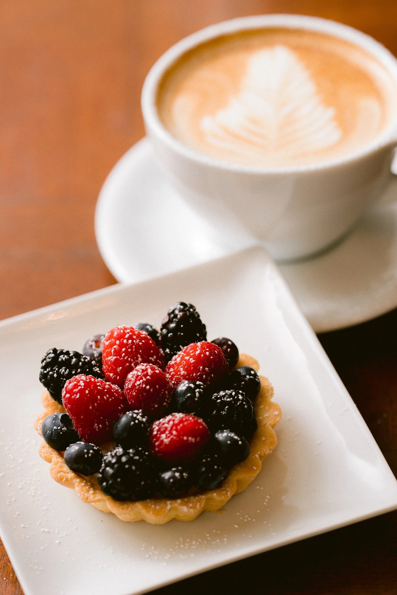   Handcrafted Portland Oregon wedding dessert featuring a fresh berry tart, styled for an elegant wedding or event dessert table.  