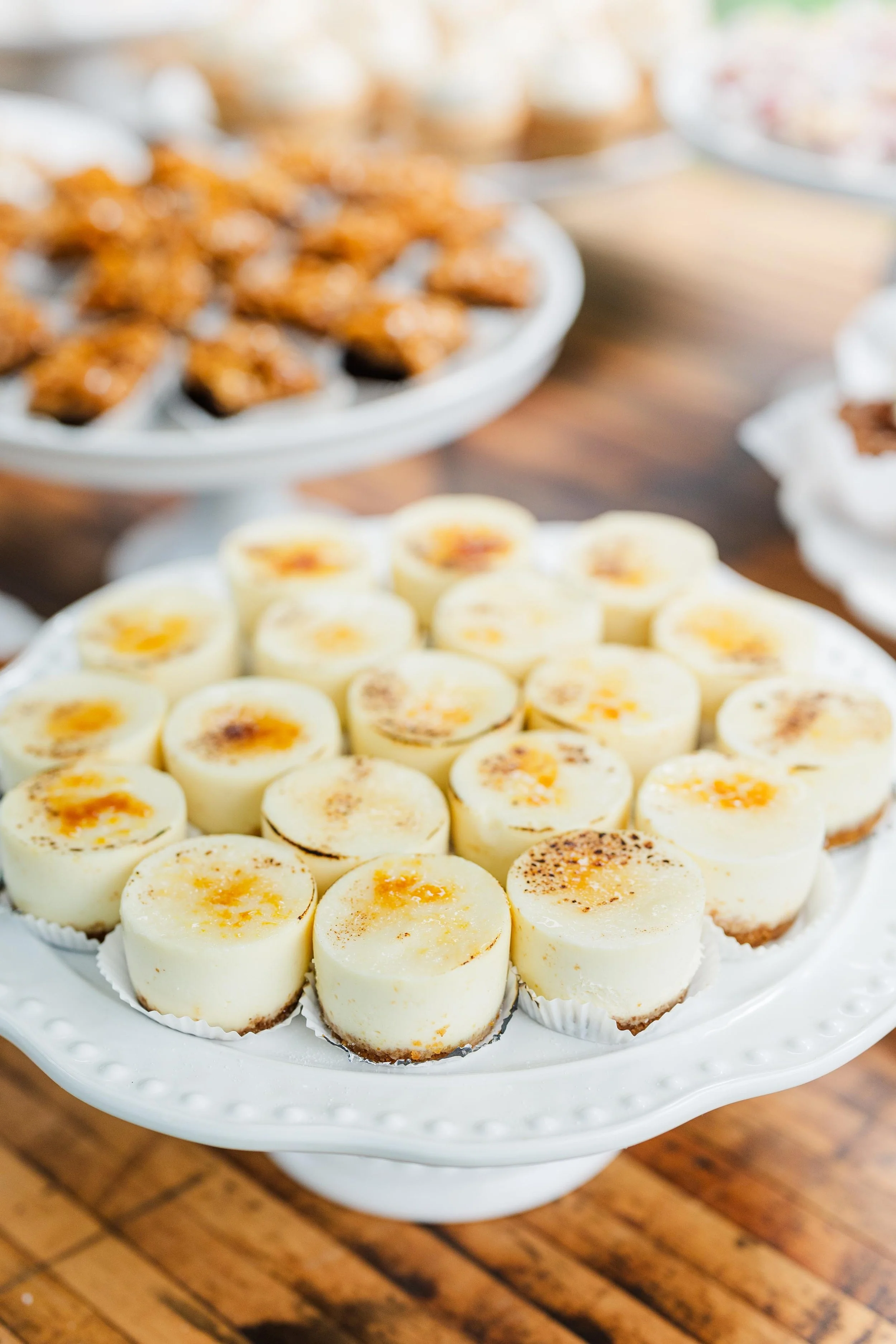   Portland Oregon wedding mini desserts featuring classic cheesecake bites, styled on a neutral dessert table for an elegant reception.  