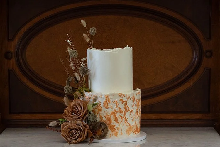   Portland Oregon wedding cake with textured buttercream and dried floral accents, displayed as a custom cake for an elegant wedding reception.  