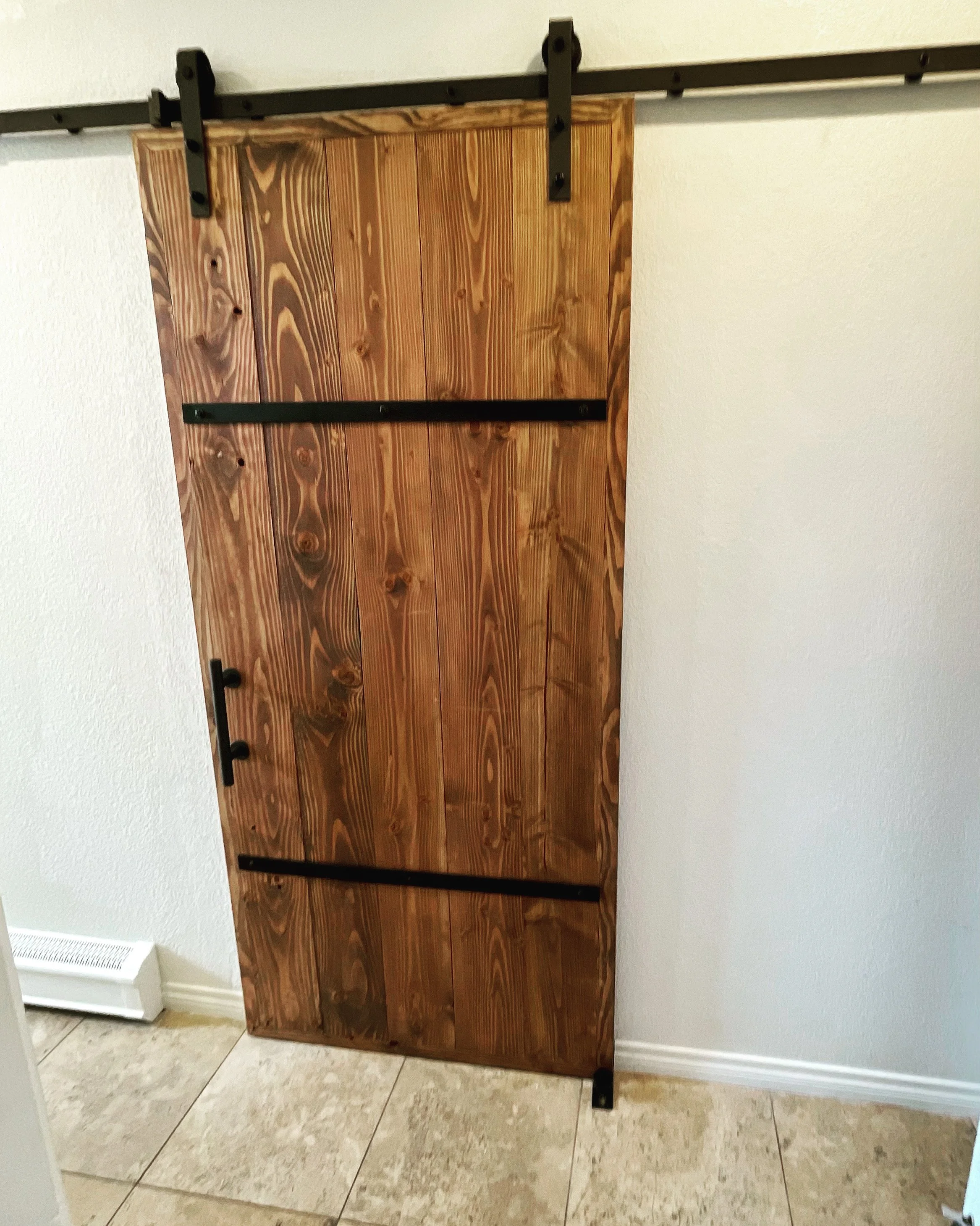 Custom built barn door and installation in Denver