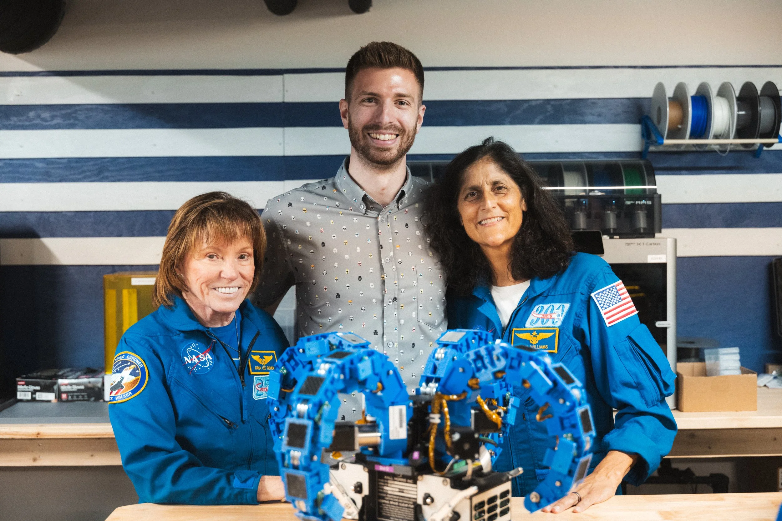 Austin Morris with Dr. Anna Fisher and Sunita Williams, celebrating the return of REACCH to KMI headquarters