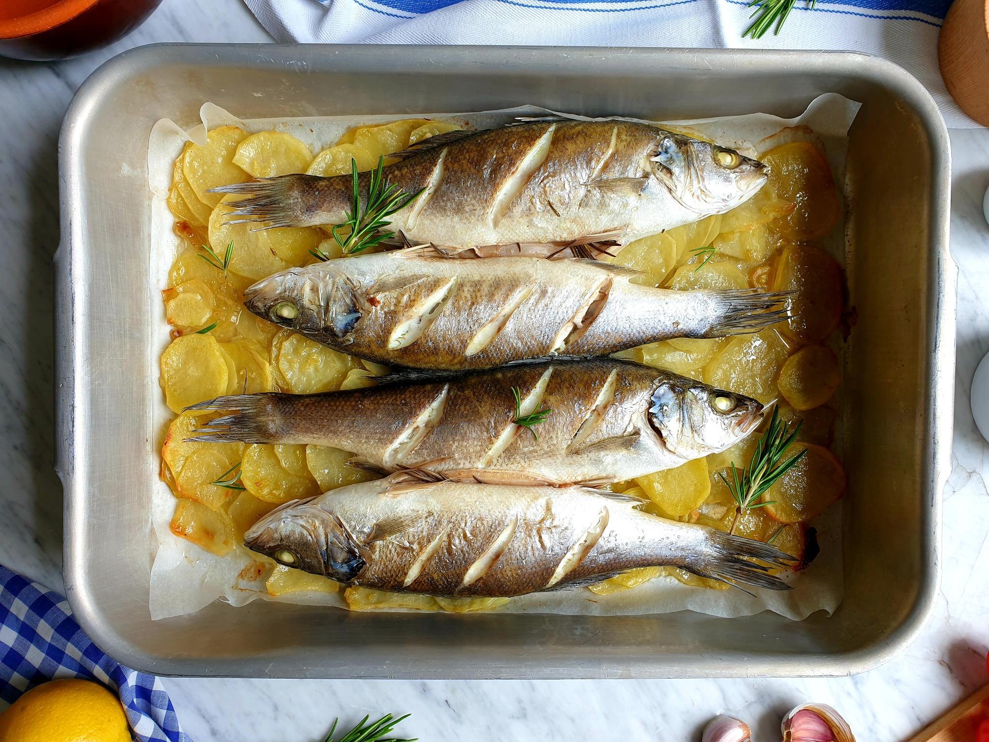 Whole baked Sea Bass on roasted potatoes Istrian Recipe
