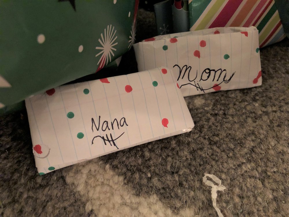 homemade presents by our 6-year old, lovingly wrapped and placed under the tree