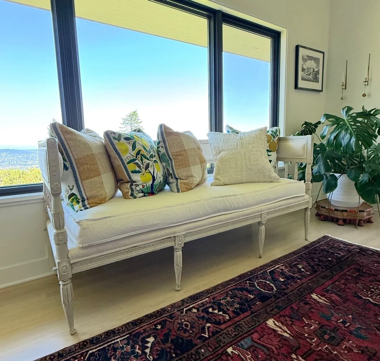 An 18th century Swedish daybed in Clarence House Belgian linen, placed where it belongs &mdash; against windows specifically chosen to reduce UV and protect against fading, the city of Portland spread out below.

The pillows are Perennials and Schuma