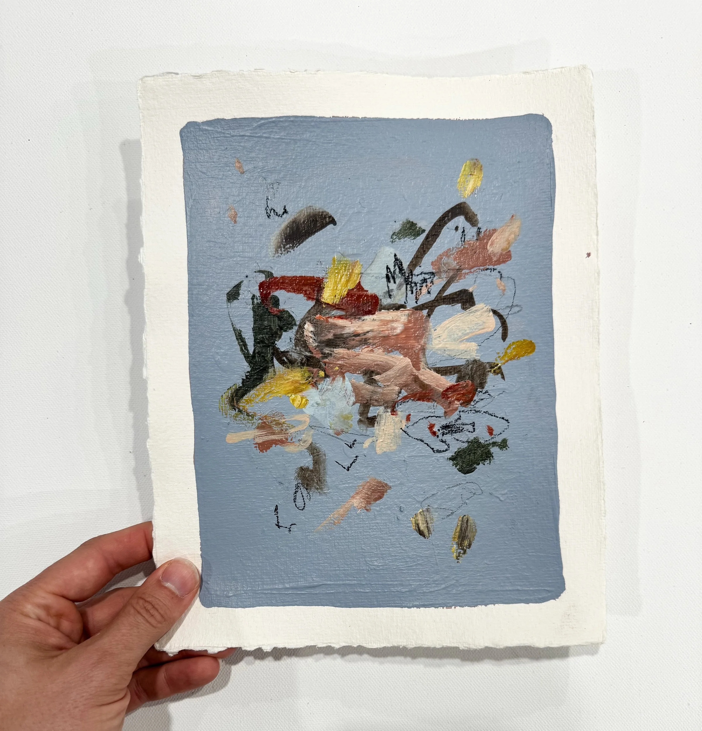 original abstract painting on paper with a soft blue background and multicolor marks