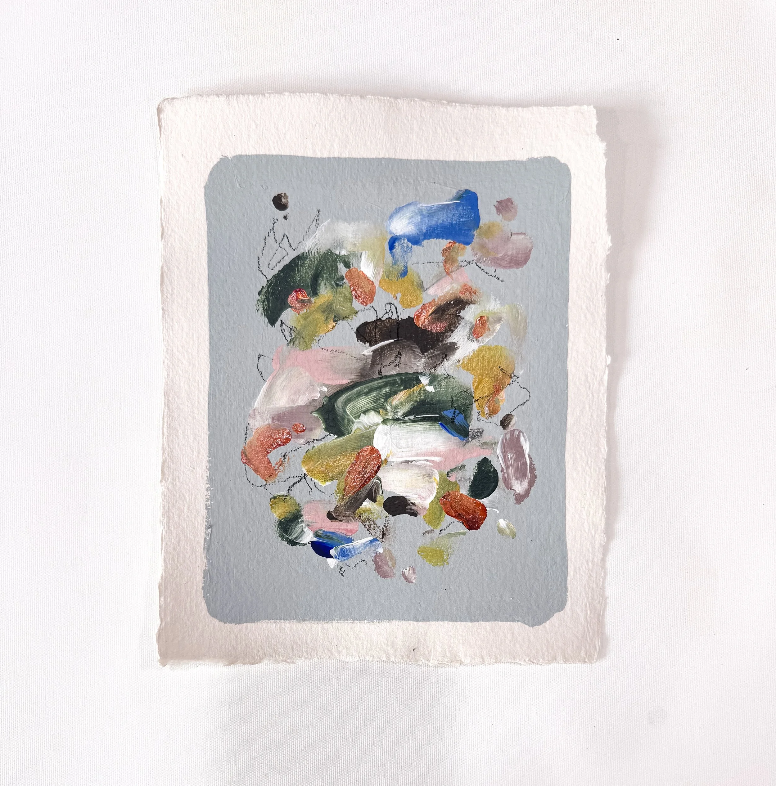 Small original abstract painting on handmade paper with light blue background and multicolor marks