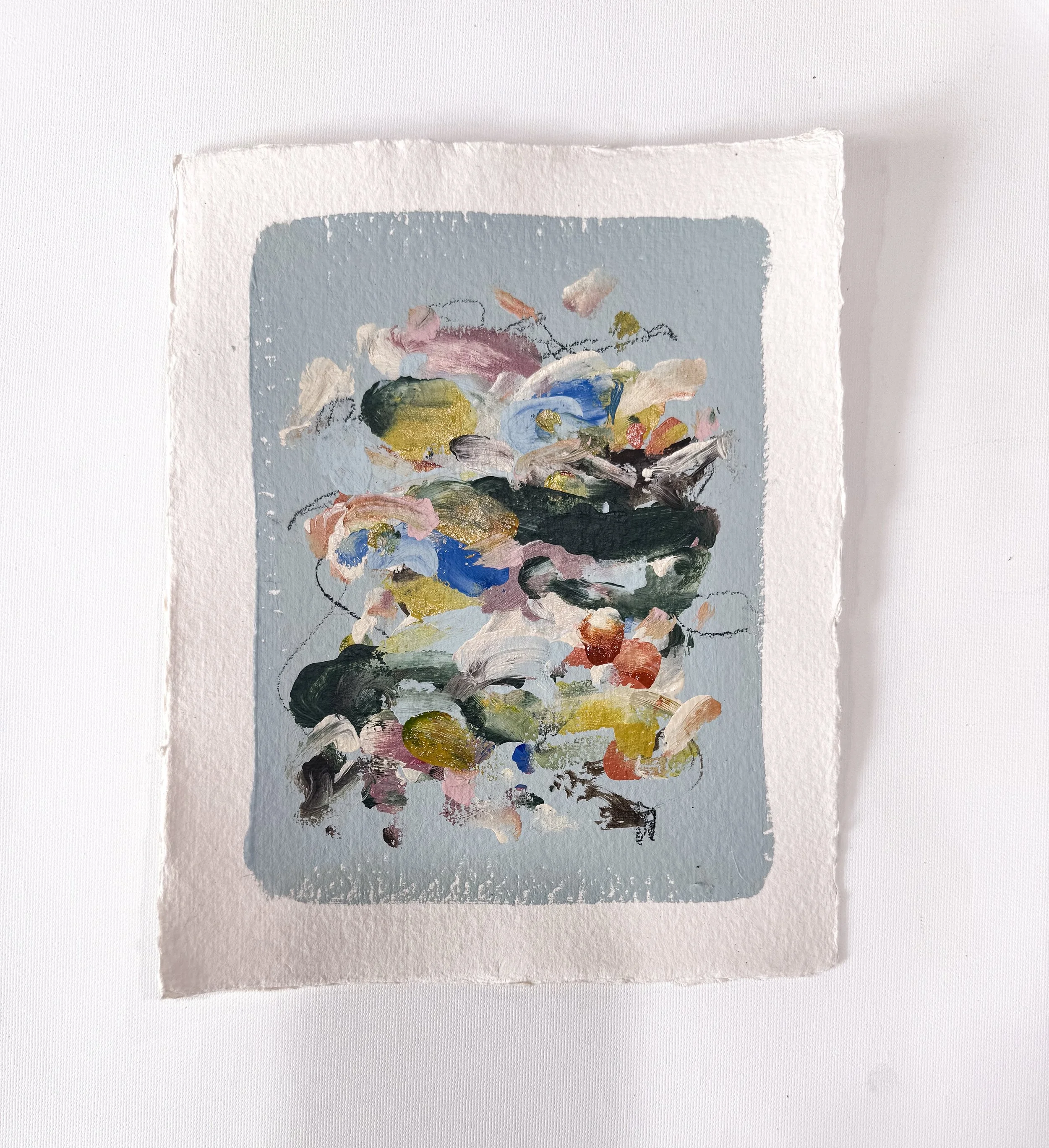 Small original abstract painting on handmade paper with a light blue background and multicolor marks