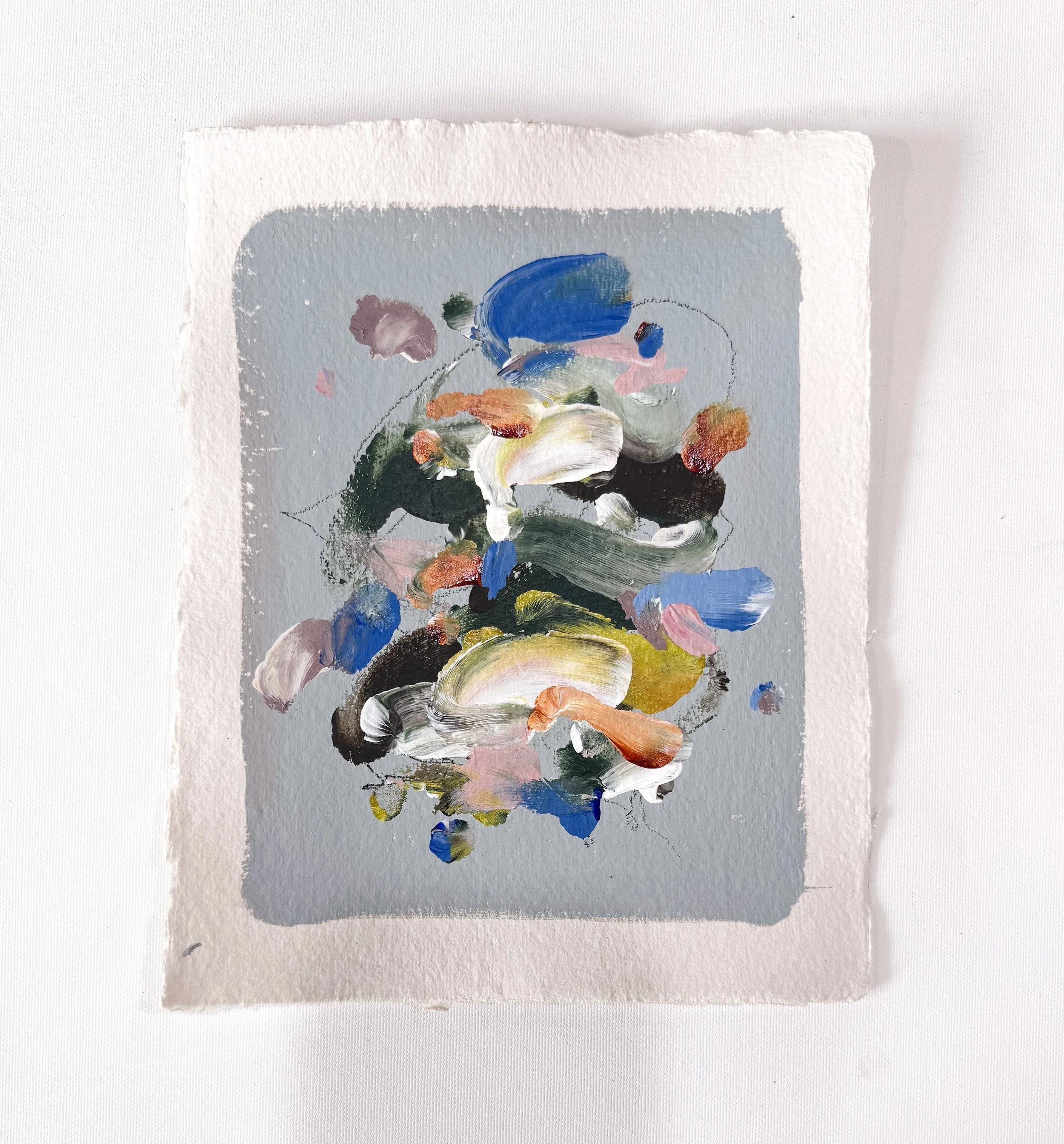 Small original abstract painting on handmade paper with light blue background and multicolor marks